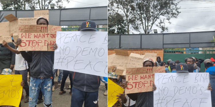 A group youth carrying placards outside Boniface Mwangi's office. PHOTO/ courtesy