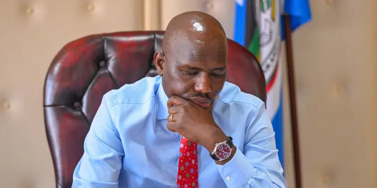 Interior CS Kipchumba Murkomen going through several doucments in his office. 