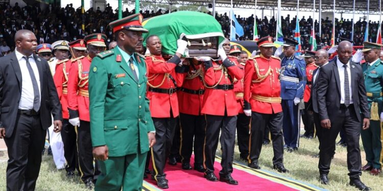 AFP | Tanzania Police Defense Force (TPDF) personnel carry the coffin of the late President Leaders from across Africa attended Magufuli's state funeral a day after the stampede