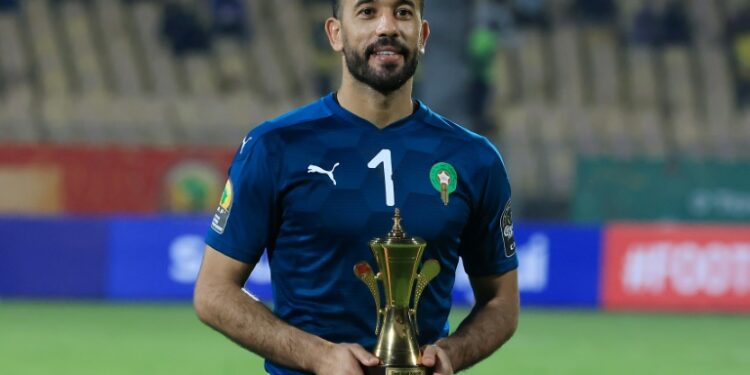 Morocco and Raja Casablanca star Anas Zniti holds the trophy awarded to the best goalkeeper after the African Nations Championship in Cameroon this year | AFP