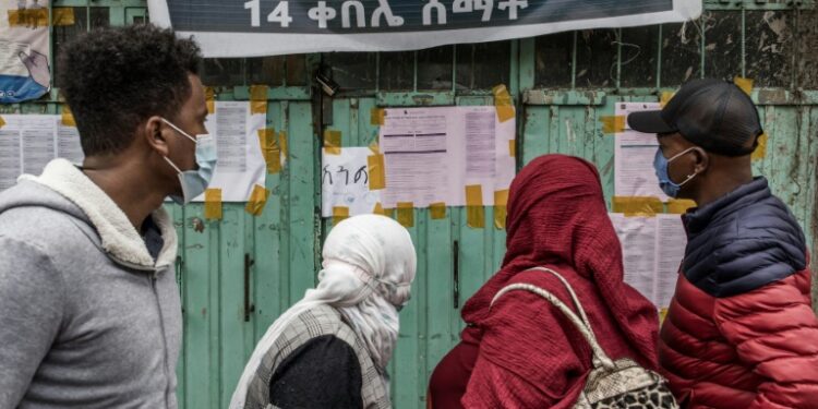 Preliminary results are being posted outside polling stations in Addis Ababa, drawing crowds | AFP