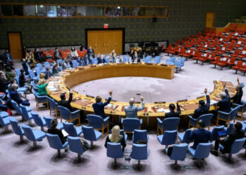 Representatives of the UN Security Council member states raise their hands to vote | Loey Felipe/UN Photo/Handout via Xinhua