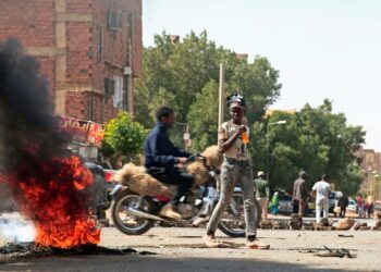 Sudanese demonstrators barricade a street in Khartoum Tuesday amid ongoing protests against a military coup | AFP