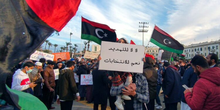 Libyans demonstrate in the capital Tripoli on February 11 to demand elections | AFP