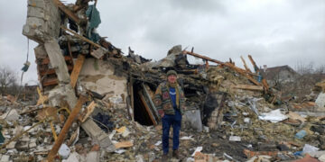A Ukrainian man stands in the rubble in Zhytomyr following Russian bombing | Emmanuel DUPARCQ
