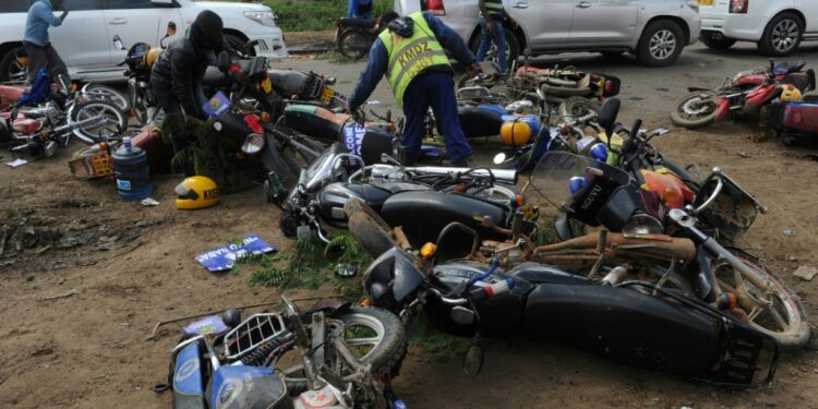 Motorcycle taxi drivers in Kenya are typically young men and are notorious for breaching the highway code | AFP