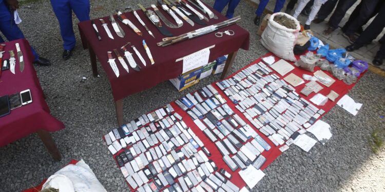 Police In Nakuru Display Items recovered during a crackdown on the confirm criminal gang