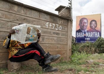 The race is currently too close to call between presidential frontrunners William Ruto and Raila Odinga (left on the billboard) | AFP