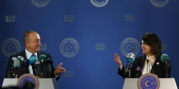 Libyan Foreign Minister Najla al-Mangoush and Turkish Foreign Minister Mevlut Cavusoglu speak to reporters after s signing a maritime gas deal | AFP