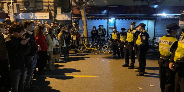 People confront a line of police officers in Shanghai, China.
Photo: Sky News