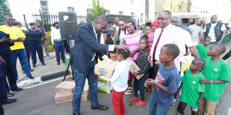 Nairobi Governor Johnson Sakaja interacts with children after lighting the governors Christmas tree at city hall.Photo/Courtesy