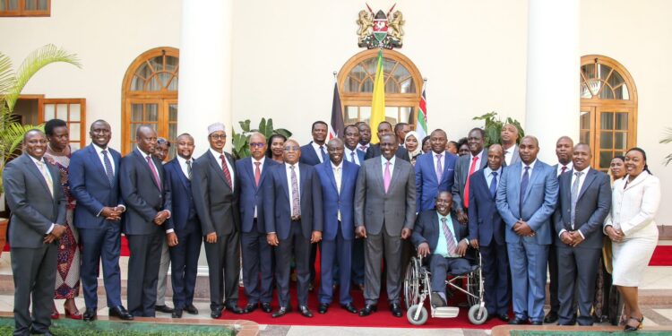 President William Ruto poses for a photo at State House Nairobi on Wednesday, February 8 with 30 Jubilee party MPs.PHOTO/State House Nairobi.