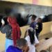 The Club President Fred Kyule paints a blackboard at Kwa Mang'eli Primary alongside members of the club and pupils from the school: Photo Courtesy of the Rotaract Club of Athi-River