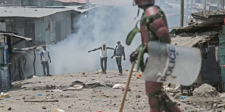 Protesters face off with an anti-riot police officer in Nairobi, Kenya, in March 2023 |  Tony Karumba/AFP via Getty Images