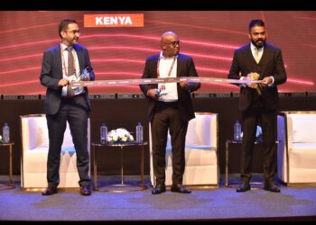 KIB Acting CEO James Wanjagi (Center) Sudhir Ranjan Jena (Left), and Isfandyar Zaman Khan (Right) cutting the ribbon to officially kick off World Financial Innovation Series (WFIS) 2023 – Kenya.