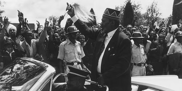 Kenya’s first president Jomo Kenyatta waves at a crowd | Harry Benson/Getty Images
