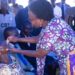 Minister of Health Dr Jane Ruth Aceng vaccinates a member of the community at the OCV launch (1). PHOTO/Courtesy