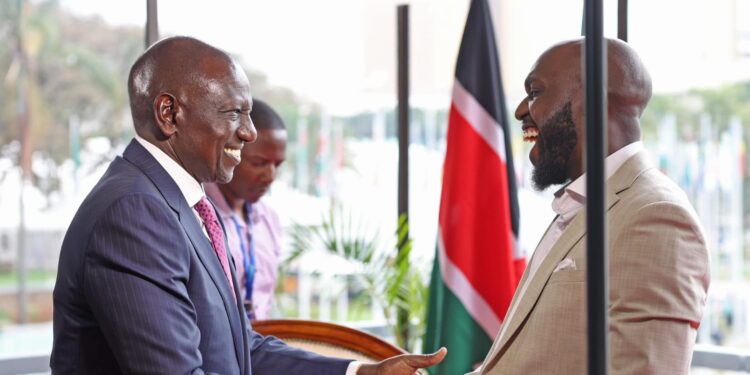 President William Ruto (left) shares a light moment with CNN journalist Larry Madowo during the Africa Climate Summit in Nairobi.