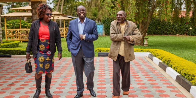 Deputy President Rigathi Gachagua (center) interacts with friends at his rural home in Mathira, Nyeri County on September 24, 2023.