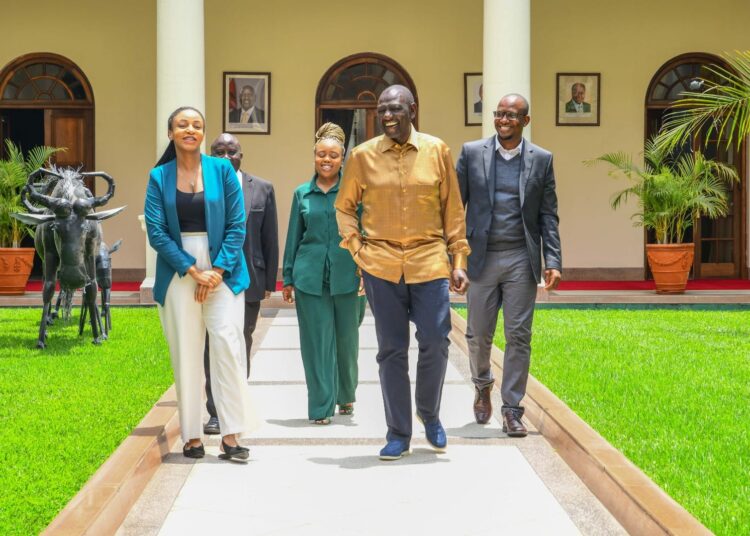 President William Ruto (left) and TikTok Africa executives take a stroll in State House after a meeting. 