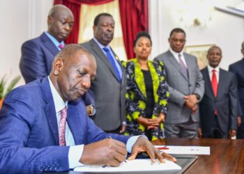 President William Ruto signs the Finance Bill 2023 into law on June 26, 2023. Looking on are Deputy President Rigathi Gachagua, Prime Cabinet Secretary Musalia Mudavadi and other leaders.