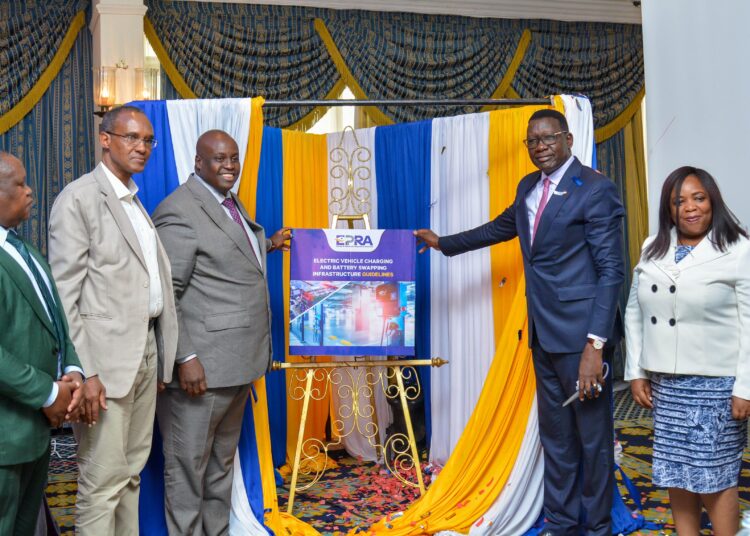Energy Cabinet Secretary Davis Chirchir (third from right) and EPRA Director General Daniel Kiptoo (third from left) join other leaders in unveilling the