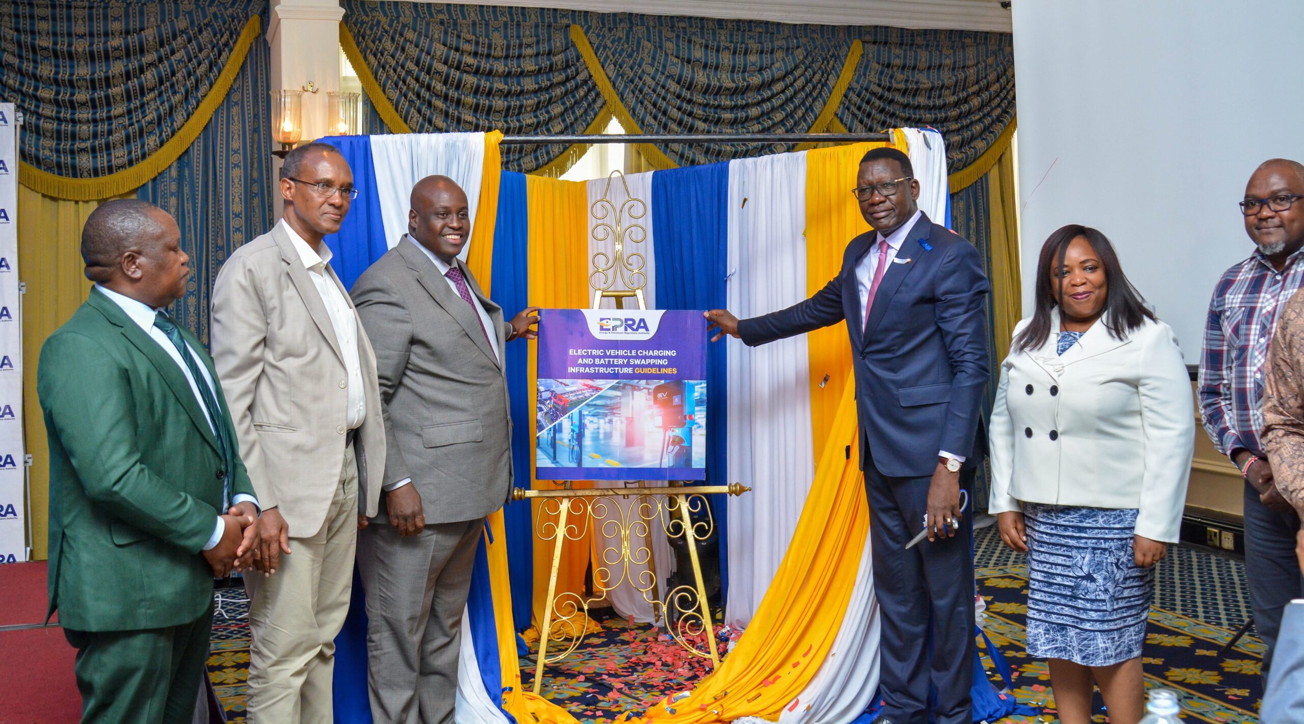 Energy Cabinet Secretary Davis Chirchir (third from right) and EPRA Director General Daniel Kiptoo (third from left) join other leaders in unveilling the