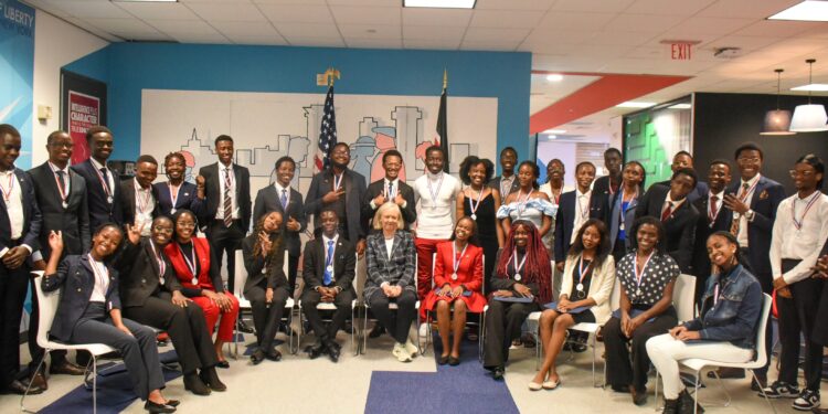US Ambassador to Kenya Meg Whitman (center) poses for a photo with Kenyan scholars under the US Education program in 2023.