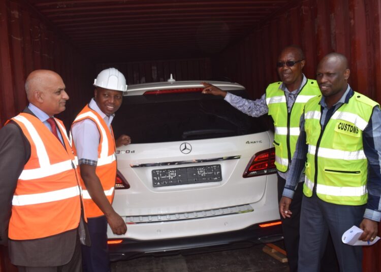 KRA officers with one of the impounded vehicles at the Port of Monasa. 