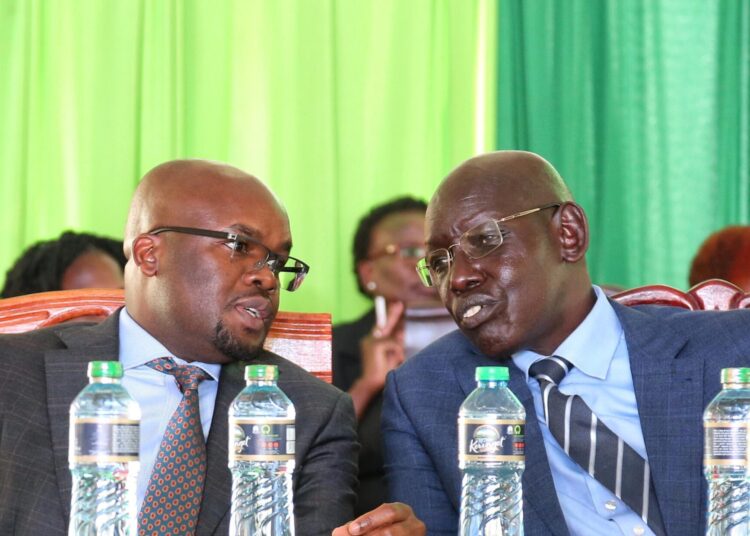 Internal Security PS Raymond Omollo (left) and Basic Education Belio Kipsang during the unveiling of the new national exam period. 