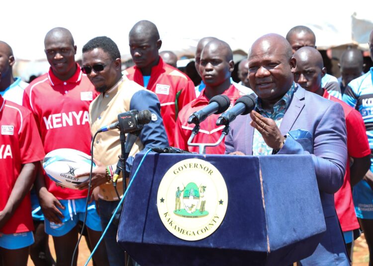 Kakamega Governor Fernades Barasa (right) and Sports CS Ababu Namwamba during the launch of the East African Secondary School Rugby 7s Championships in Kakamega County. 