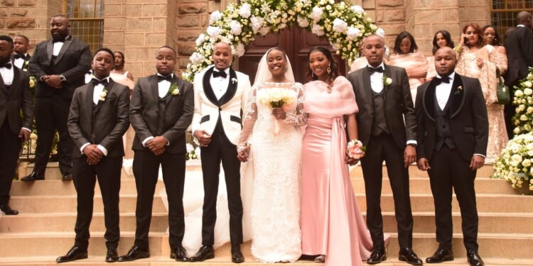 Maryanne Mudavadi (in white gown) poses for a photo with bridal party during her wedding on October 28, 2023. 