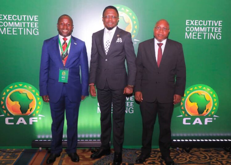 Sports Cabinet Secretary Ababu Namwamba (center) poses for a photo with Hon Damas Ndumbaro, Sports and Arts Minister of Tanzania and Hon Peter Ogwang, State Minister for Sports of Uganda when they presented the EAC bid in Cairo, Egypt. 
