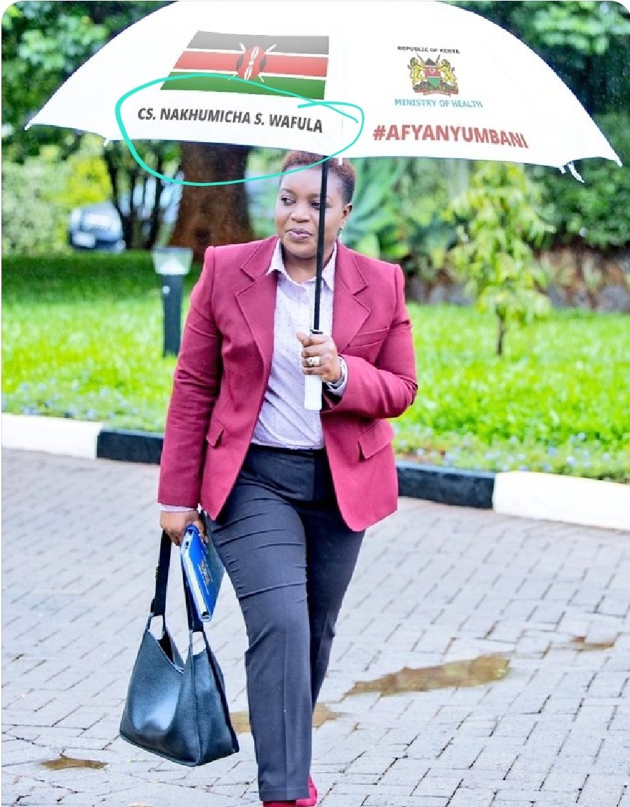 Health CS Susan Nakhumicha carrying an umbrella with her name on it. PHOTO/Courtesy.