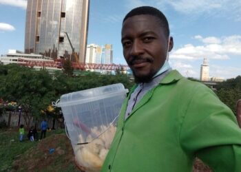 Isaac Juma during his normal pineapple hawking business. PHOTO/Courtesy.