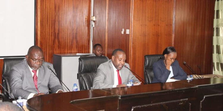 KQ leaders led by CEO Allan Kilavuka (center) appear before the Transport Committee in parliament on October 24, 2023. 