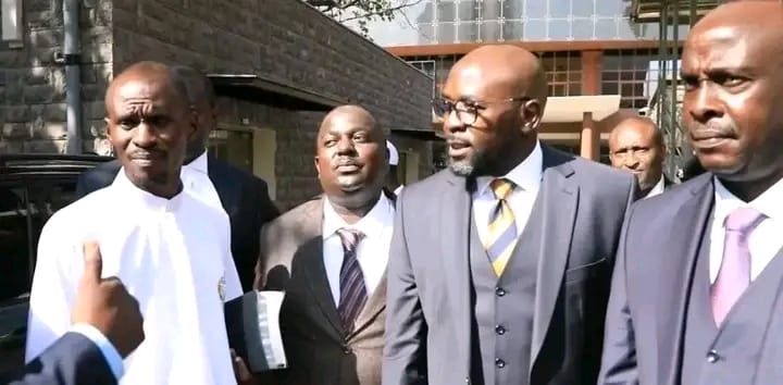 Lawyers Cliff Ombeta (center), Danstan Omari (right) and their client [Pastor Ezekiel Odero at the Shanzu Law Courts.