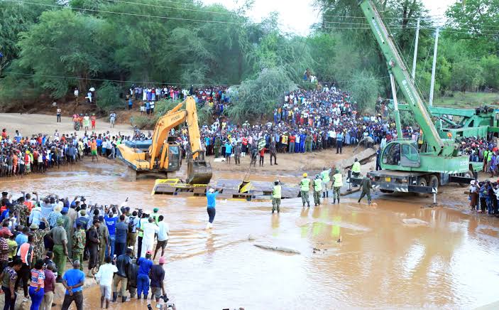 Cranes retrieve the wreckage of a bus that drowned in Enziu River on December 4, 2021. PHOTO/Dennos Kavisu.
