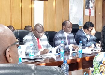 Cooperatives Cabinet Secretary Simon Chelugui (in red tie) attends a past meeting.