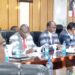 Cooperatives Cabinet Secretary Simon Chelugui (in red tie) attends a past meeting.