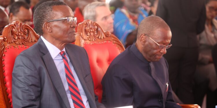 Former Chief Justice David Maraga (left0 and his predecessor Willy Mutunga follow the proceedings of a Judiciary event on November 24, 2023 at the Supreme Court.