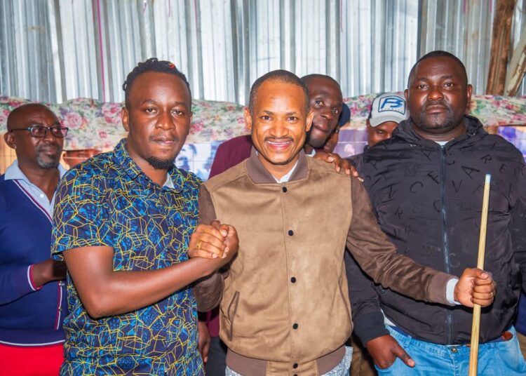 Embakasi East MP Babu Owino with supporters after launching a pool tournament in Utawala ward.
