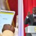 A Collage of National Government Administrative Officer uses a tablet in the past (left) and President William Ruto (Right) PHOTO/Courtesy