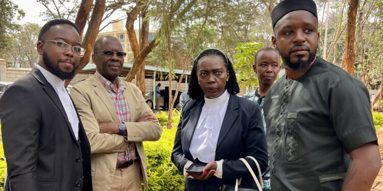 Activist Boniface Mwangi (right) arrives at the Machakos High Court on November 1, 2023. Accompanying him are Martha Karua and a other activists.