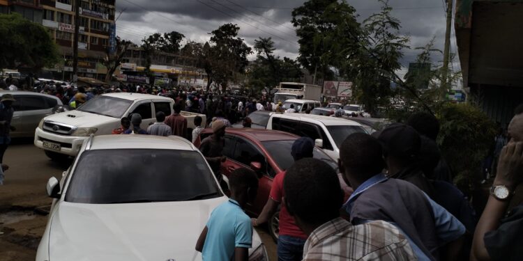 Residents in Ruiru Town gather around the scene where the suspect was arraested.