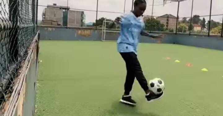 A Kenyan girl juggles a ball at a pitch in Nairobi's Kibera slums in the video shared by Manchester City.