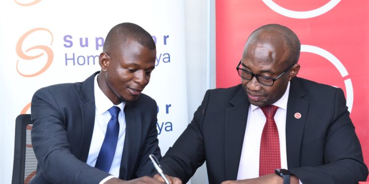 Superior Homes Kenya Head of Sales Clive Ndege and Absa Bank Regional Manager and Head of Mortgage Retail and Business Banking John Kaburu sign a mortgage financing deal