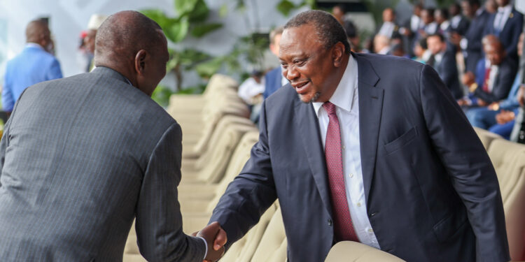 President William Ruto shakes hands with his predecessor Uhuru Kenyatta during the swearing in of DRC President Félix Antoine Tshisekedi Tshilombo. Rigathi Gachagua