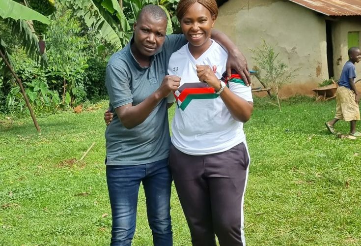 Boxer Conjestina Achieng (left) poses for a photo with sports journalist Carol Radul. 