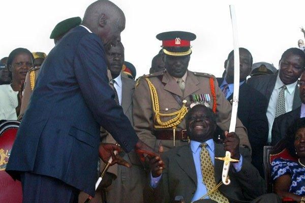 Kenya's second President Daniel Arap Moi 9left0 hands over power to his successor Mwai Kibaki at Uhuru Park in December 2002. 